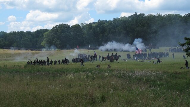 Battle reenactment with mounted riders and smoke at Gettysburg Pennsylvania