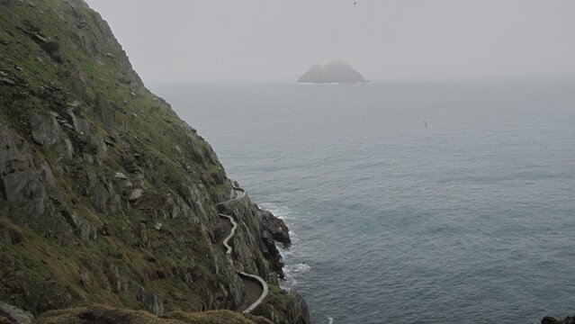 Narrow stone path above the Atlantic on Skellig Michael in Ireland
