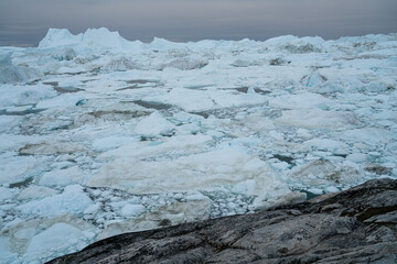 Global warming - Greenland Iceberg landscape of Ilulissat icefjord with giant icebergs. Icebergs from melting glacier. Arctic nature heavily affected by climate change. © Maridav