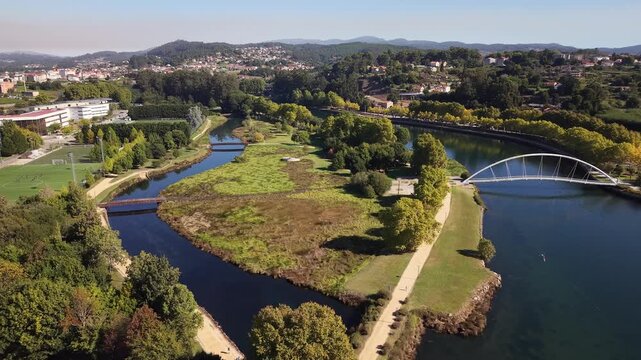 Aerial drone shot showing the city of pontevedra, the l&eacute;rez river, and the tirantes bridge in galicia