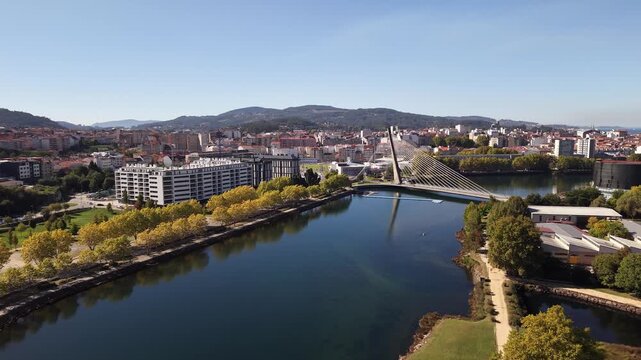 Aerial drone shot showing the city of pontevedra, the l&eacute;rez river, and the tirantes bridge in galicia