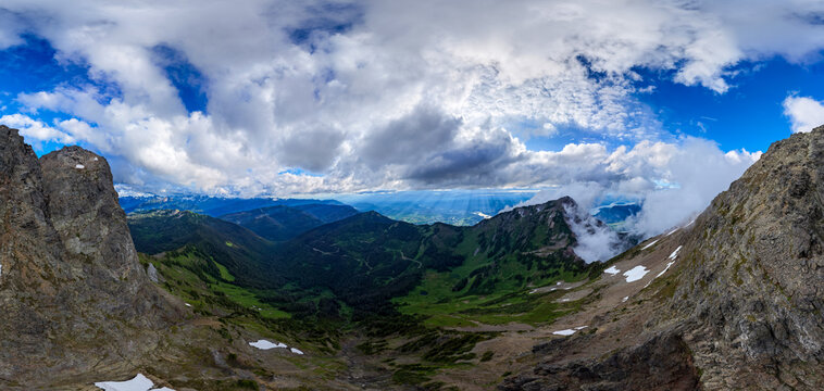 Panoramic Mountain View Over Chilliwack Valley With Dramatic Clouds and Alpine Peaks in BC