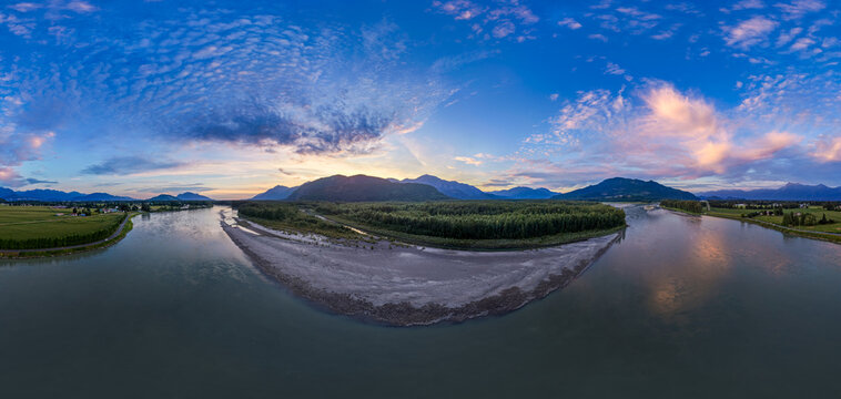 Sunset Panorama Over River Bend and Forested Island With Mountains Near Chilliwack, BC, Canada
