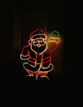 Illuminated Santa Claus rope light silhouette decoration at night