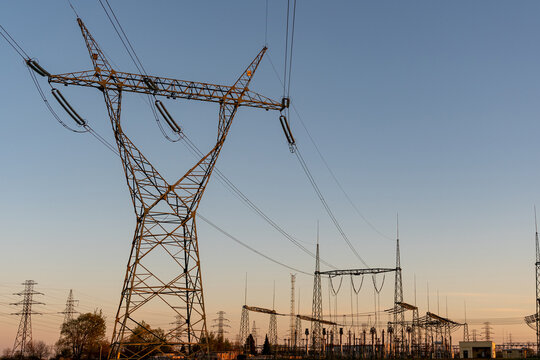 Power grid infrastructure with overhead transmission lines.