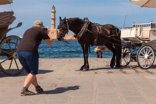 Horse Carriage and Tourist Photographer in Chania, Crete, Greece