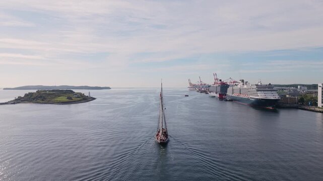 Aerial view of a sailboat navigating Halifax Harbour in Nova Scotia