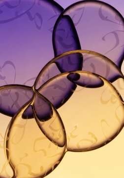 Layered abstract design featuring overlapping translucent fluid cells in ultraviolet and pale gold gradients with faint calligraphic patterns, soft, healthcare, fluid