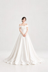 Fototapeta premium Korean women's wedding dress, wedding shoot snaps, K-beauty aesthetic hair, fashion model, veil, bridal gown, wedding hall, planner, princess, white, groom and bride makeup, tiara studio photo shoot