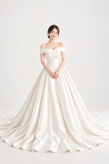 Fototapeta premium Korean women's wedding dress, wedding shoot snaps, K-beauty aesthetic hair, fashion model, veil, bridal gown, wedding hall, planner, princess, white, groom and bride makeup, tiara studio photo shoot