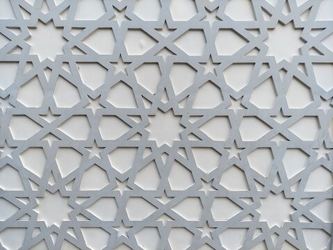 Modern white islamic geometric pattern wall ornament with star shapes and traditional arabesque architectural lattice design background