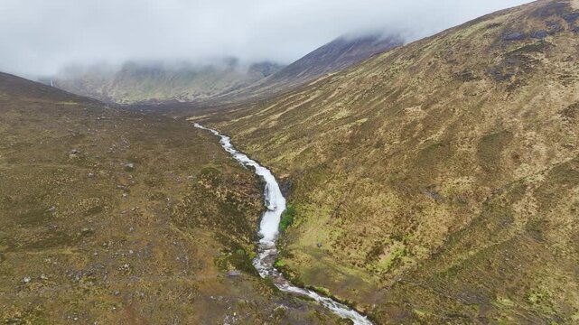 Eas a' Bhradain Waterfall from a drone, Blackhills Waterfall, Loch Ainort, A87 road, Isle of Skye, Scotland, England, United Kingdom
