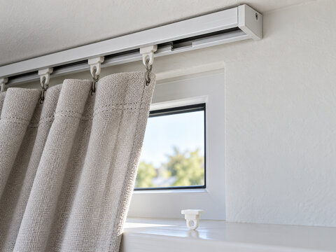 Curtain track with replacement glider on a windowsill