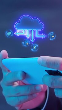 Hands holding smartphone vertical shot with glowing cloud data storage upload and transfer icons. Mobile wireless server backup, telecommunication file synchronization, and digital system concept.