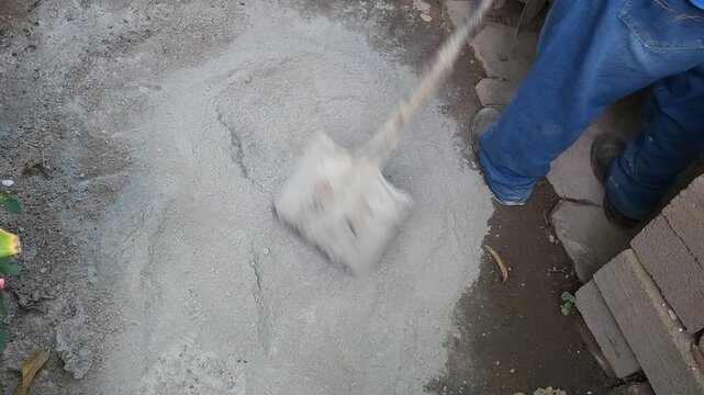 Creating Well in Sand and Cement Mix for Water Addition
