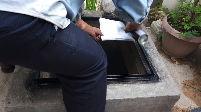 Spray Painting Metal Frame Edges of Cistern Structure
