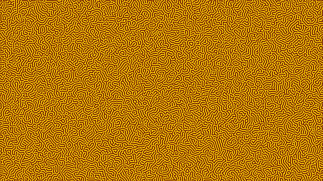 Seamless Turing pattern with yellow and red organic lines on a black background