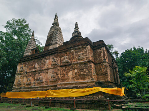Wat Chet Yot is a beautiful, ancient temple featuring seven pagodas, located in Chiang Mai Province, Thailand