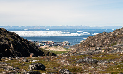 Greenland travel - aerial drone video view of Ilulissat City and icefjord. Tourist destination in the arctic. © Maridav