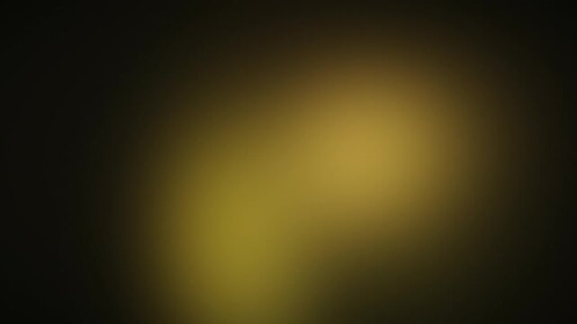 Soft glowing golden gold lights drifting on dark background, seamless abstract gradient loop for music visuals