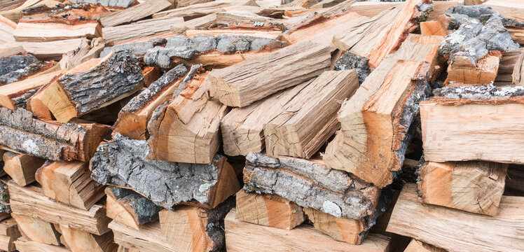 Pile of chopped firewood. Chopped firewood logs stacked