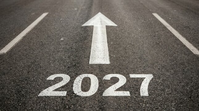 The number 2027 painted on an asphalt road with a white arrow pointing forward, symbolizing future goals, planning, and moving ahead in the new year