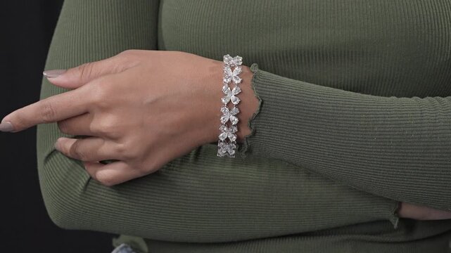 Designer diamond tennis bracelet with invisible setting with model image for ecommerce use 