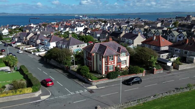 Sea view neighbourhood property aerial view pan across Holyhead marina waterfront homes