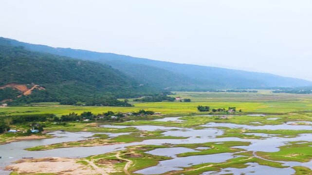 Natural Hill Border And Shallow Pools Of Water Across Bichanakandi in Sylhet, Bangladesh, Surrounded By Lush Green Hills And Natural River Landscape. Panning Shot