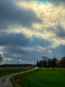 Serene countryside scene, Tranquil natural setting under cloudy skies