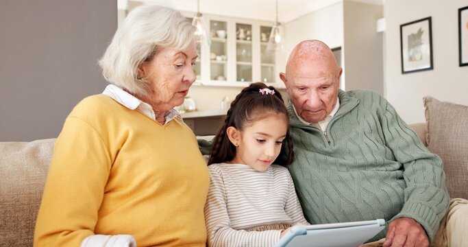Grandparents, relax and child at house with tablet, streaming and download games for education. Senior people, babysitting and girl in home with digital, internet search and online quiz for learning