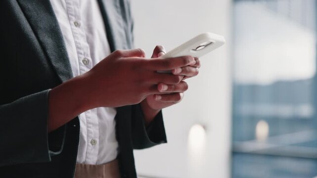 Hands, woman and lawyer in office with phone, contact witness and new evidence for court case. Attorney, typing or review at law firm with mobile, upcoming trial and testimony for proceedings verdict