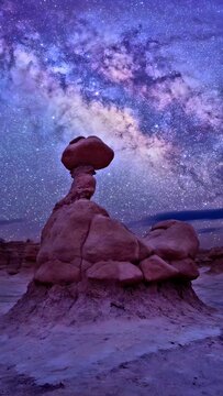 Rock with stars in the sky at night 
