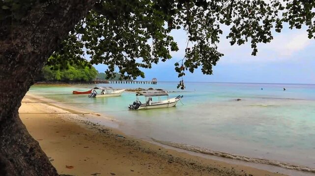 Paradise beach with boats at Pulau Weh island Aceh Sumatra Indonesia