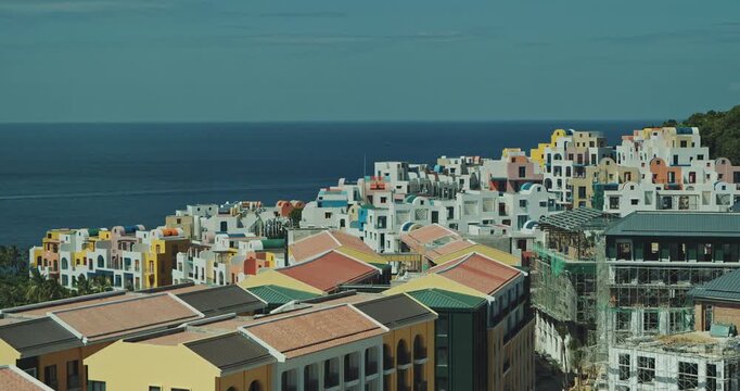 Colorful Hillside Resort Buildings Beside Blue Sea on Hon Thom Island