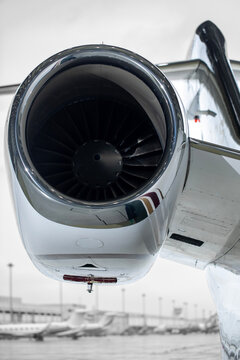  Jet engine intake and fan blades at an airport.