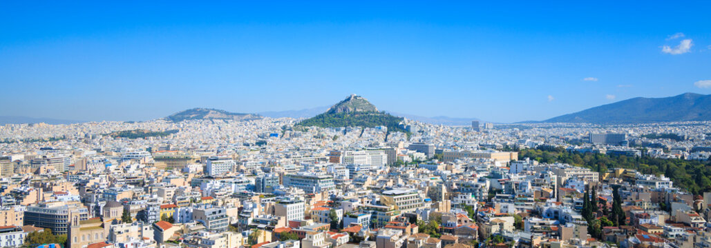 panoramic aerial view of athens cityscape with mount lycabettus under blue sky greece