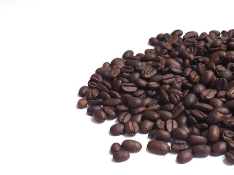 Roasted Coffee Beans Corner Pile on White Background with Copy Space