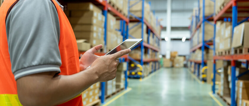 Asian male factory staff check goods in warehouse or inventory and stock product by tablet. Transport logistic business shipping, delivery to customers. inspection, storehouse, storage, factory