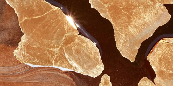 Abstract composition of gold leaf fragments on dark lacquer surface with metallic sheen and textured edges under dramatic lighting