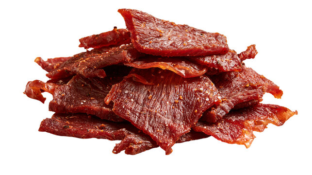 Stack of seasoned beef jerky slices with visible spice and salt particles