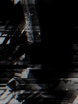 Dark digital noise and scanlines create a distorted monochrome glitch effect across a black void. Designers use this texture for edgy album covers and cyberpunk website headers.