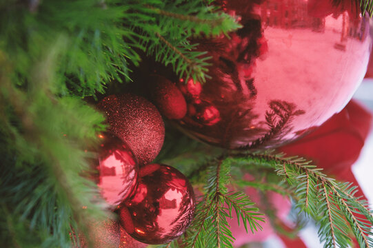 Festive pine tree decoration captured with a red ornaments