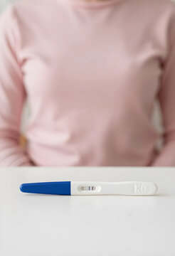 Pregnancy test with positive result, family planning and fertility concept, woman waiting for medical news at home with anticipation and life change