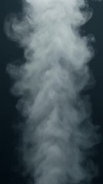 Vertical white steam or smoke rising against dark background loop video footage