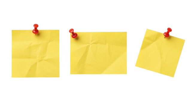 Crumpled yellow square note papers with pushpins isolated