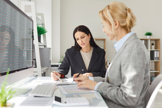 Businesswomen market growth study at screen, profit exam, trading at workplace to make analysis of investments to acquire capital gains, dividend distributions, interest payments, purchase of stocks