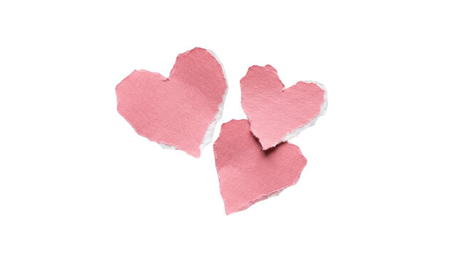 Three torn pink paper hearts isolated on transparent background