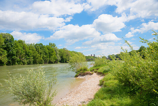 green riparian zone Isar river munich, recreational area. blue sky with clouds