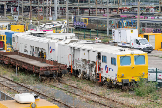 Nancy, France - September 30th 2026 : View on a universal tamping machine Plasser & Theurer 108 475 ST on a railway construction site for the replacement of switches in a station.